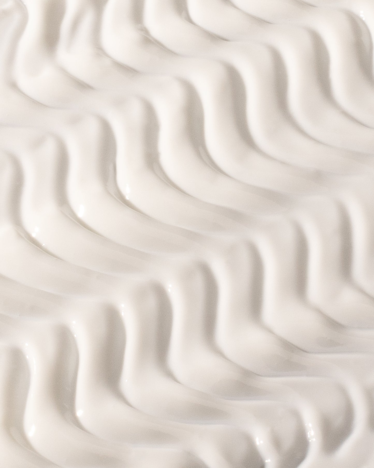 The Sun, DF18+ face sunscreen serum with SPF 50+, shown with its texture.