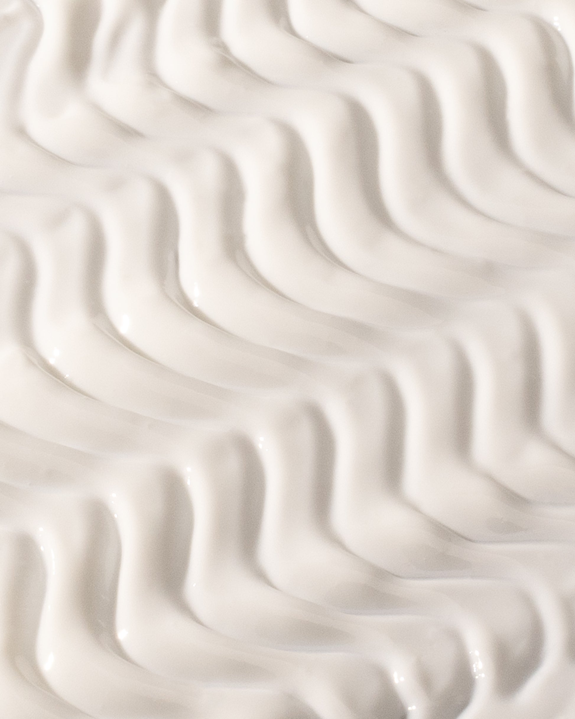 The Sun, DF18+ face sunscreen serum with SPF 50+, shown with its texture.